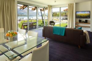 a living room with a couch and a table at QS Marina in Queenstown