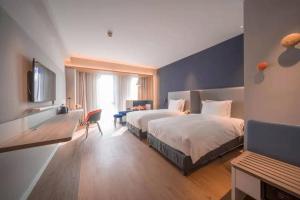 Postel nebo postele na pokoji v ubytování Holiday Inn Express Shanghai Huijin by IHG