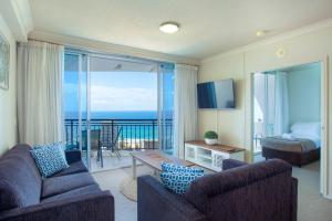 a living room with two couches and a view of the ocean at Chevron Renaissance - Private Apartments - Hosted by Coastal Letting Co. in Gold Coast