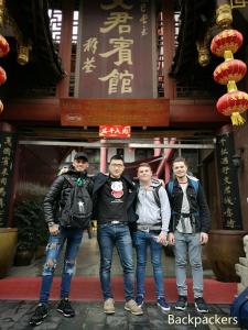 a group of four men standing in front of a building at Wenjun Courtyard Hotel ---5 mins walk from Tonghuimen metro station, near Tianfu square, close by culture park and Sichuan opera house, English speaking service, local tours in Chengdu