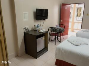 Postel nebo postele na pokoji v ubytování Baan Boa Guest House