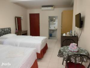Postel nebo postele na pokoji v ubytování Baan Boa Guest House