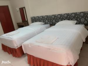 Postel nebo postele na pokoji v ubytování Baan Boa Guest House
