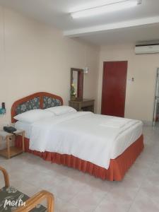 Postel nebo postele na pokoji v ubytování Baan Boa Guest House
