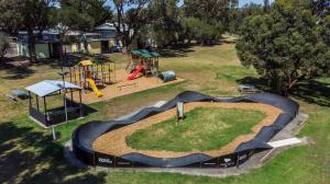 an aerial view of a park with a playground at Victor Harbor Holiday Park in Victor Harbor