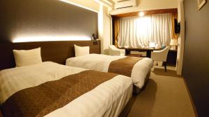 Ένα ή περισσότερα κρεβάτια σε δωμάτιο στο Kyu-Karuizawa Hotel Shinonome