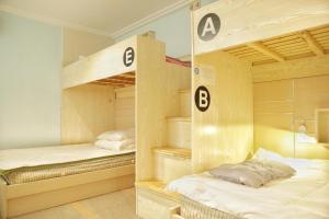A bed or beds in a room at Kunlun International Youth Hostel