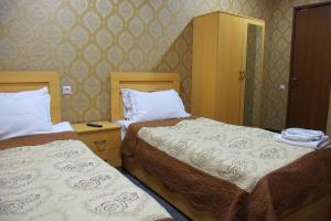 Voodi või voodid majutusasutuse Hotel Shalimar toas