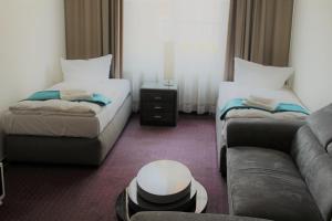 Postel nebo postele na pokoji v ubytování Check Inn Hotel Merseburg