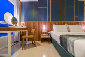 Postel nebo postele na pokoji v ubytování Hug Nimman Hotel