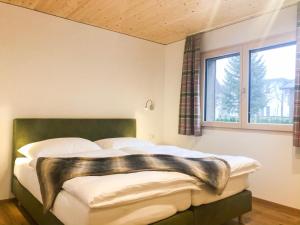 Posteľ alebo postele v izbe v ubytovaní Woodpecker Chalets