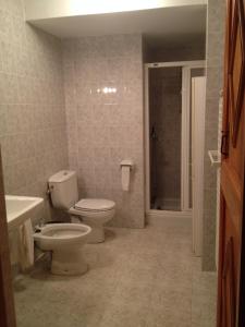 a bathroom with a toilet and a sink and a shower at Mas Vell in Catí