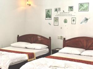 Giường trong phòng chung tại Anh Xuan Guest House