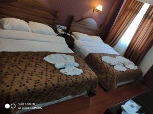 Postel nebo postele na pokoji v ubytování Hotel Bazaar