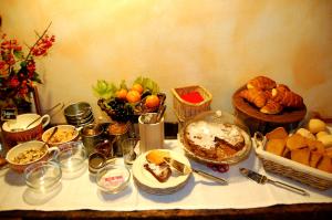 a table with bread and other foods on it at il mondo in valle in Pessinetto