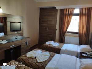 Postel nebo postele na pokoji v ubytování Hotel Bazaar