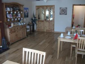 a living room with a table and a dining room at Clare Street B&B in Nenagh