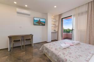 Posteľ alebo postele v izbe v ubytovaní Apartment Roso