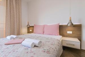 Posteľ alebo postele v izbe v ubytovaní Apartment Roso