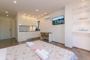 Posteľ alebo postele v izbe v ubytovaní Apartment Roso