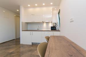 Kuchyňa alebo kuchynka v ubytovaní Apartment Roso