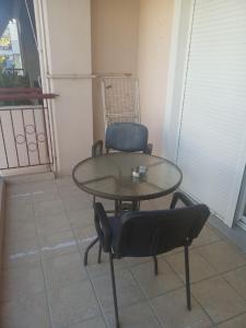 a table and two chairs sitting on a patio at Elias Appartment in Volos