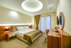 Posteľ alebo postele v izbe v ubytovaní Hotel Lazaro