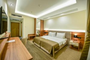 Posteľ alebo postele v izbe v ubytovaní Hotel Lazaro