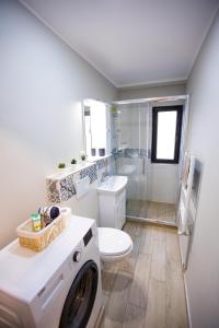 Een badkamer bij Travel Homzzz Central Apartments - Tusnad