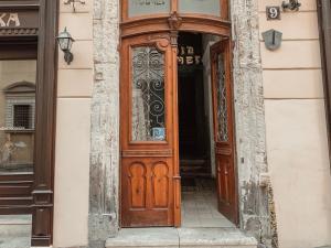 a door that is open to a building at Kurnakh Apartment in Lviv