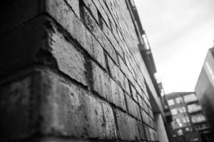 a black and white photo of a brick wall at Windmill Lane in Dublin