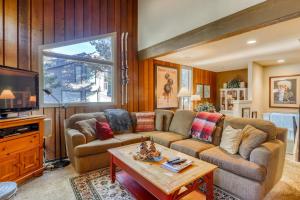 a living room with a couch and a table at Chamonix 85 in Mammoth Lakes