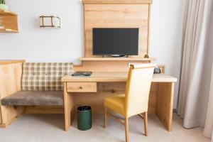 TV a/nebo společenská místnost v ubytování Hotel Gerbe