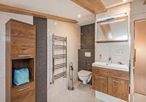 Koupelna v ubytování Ferienhaus Ingrid + 22 fotografií