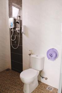 a bathroom with a toilet and a shower at OK FAMILY VILLA in Ipoh