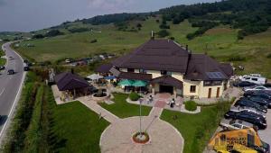 an aerial view of a house on a hill at OMLADINSKI HOTEL ROSTOVO in Bugojno