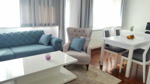 a living room with a couch and a table at Apartment Esha in Sarajevo