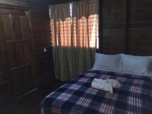 Tempat tidur dalam kamar di Matus Guest House