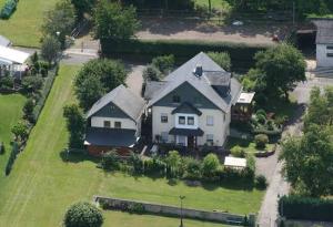 an aerial view of a house with a yard at Ferienwohnung Kirchblick in Heyweiler