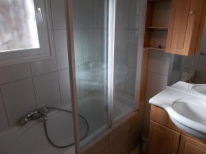 a bathroom with a shower and a sink at La Villa 05 in Chorges