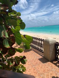 a view of the beach from a balcony at Beach Vue Barbados in Bridgetown