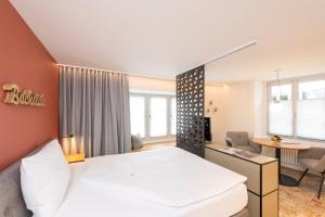 Uma cama ou camas num quarto em Hotel an der Aare Swiss Quality