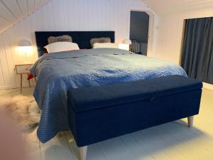Voodi või voodid majutusasutuse The Red Fjordhouse toas