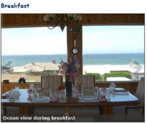 a dining room table with a view of the beach at Breyhouse B&B in Lincoln City