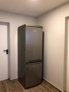 a stainless steel refrigerator in a room at Hostel Laurita in Kaunas