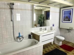 A bathroom at Charming Apartment with Mountain View