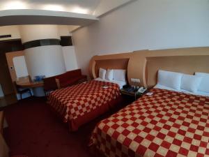 Postel nebo postele na pokoji v ubytování AUTO HOTEL LEGARIA