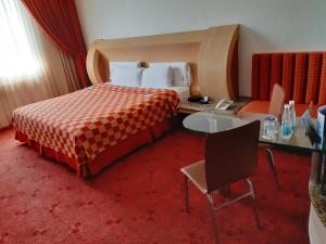 Postel nebo postele na pokoji v ubytování AUTO HOTEL LEGARIA