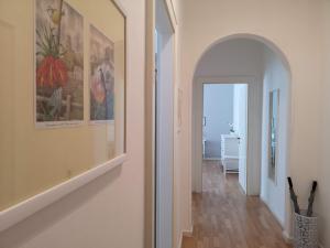 a hallway with an archway leading to a room at Italianflat - Arena di Verona, Elegant 2 Bedrooms in Verona