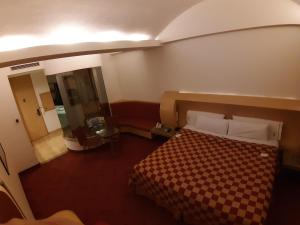 Postel nebo postele na pokoji v ubytování AUTO HOTEL LEGARIA